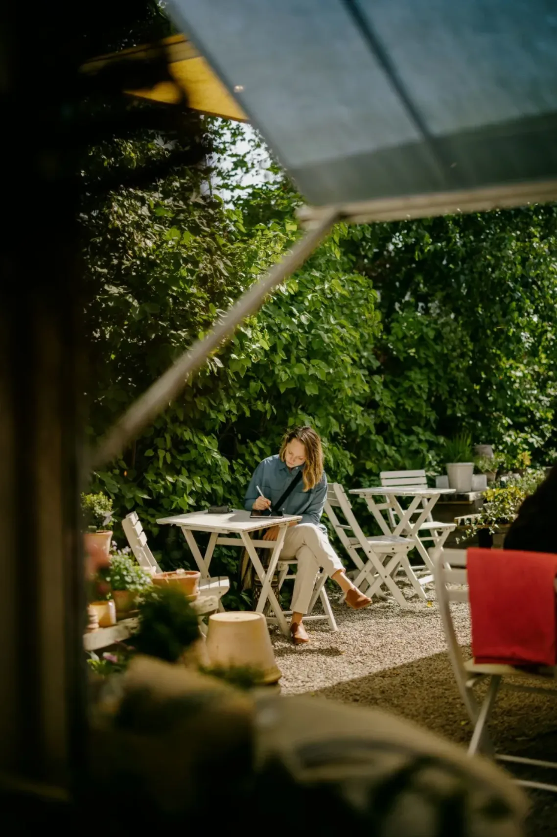 Business owner reviewing paperwork at an outdoor table